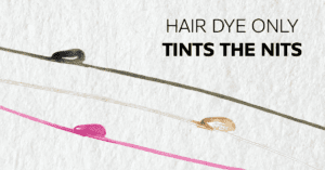 Three strands of hair with lice eggs that have been dyed with hair dye