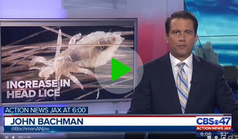 News reporter in the middle of broadcast about an increase in head lice